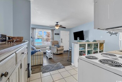 Kitchen featuring a breakfast bar area, light wood