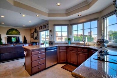 Kitchen with granite countertops connects the fami