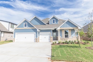 Craftsman-style house with a shingled roof, a front lawn, concrete driveway, brick siding, and board and batten siding