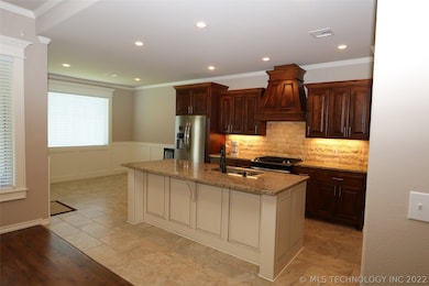 Kitchen with large center island, stainless steel