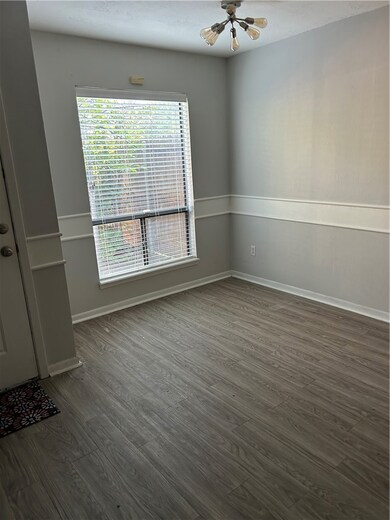 Spare room with wood finished floors, plenty of na