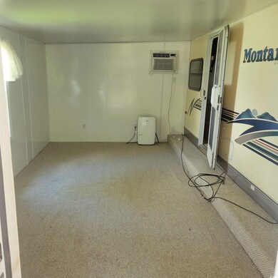 Interior space featuring light colored carpet and 