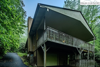   Rear covered decks and vision of upper entrance