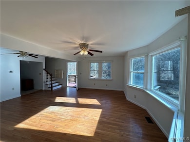 Unfurnished room featuring dark wood-type flooring
