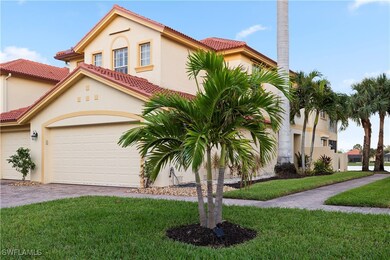home featuring a garage and a front yard