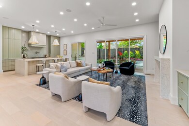 Living room with ceiling fan and a fireplace