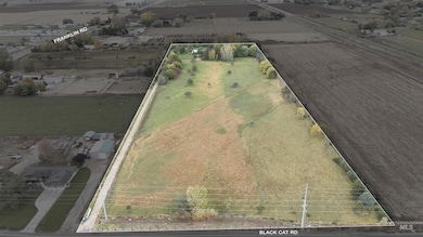 Aerial view of sparsely populated area featuring property boundaries highlighted and abundant farmland