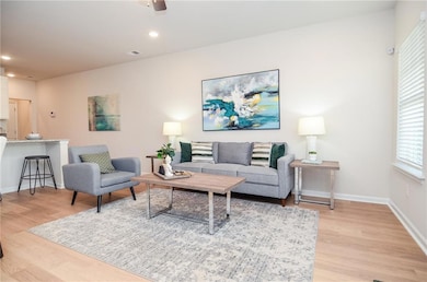 Living area featuring recessed lighting, baseboard