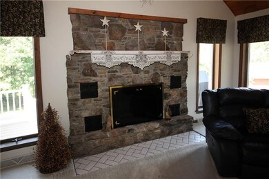 Stone fireplace and lots of natural light.