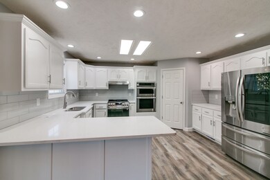 Walk-in pantry with laundry room  off kitchen. As you come from the garage shed the shoes and dirty clothes.