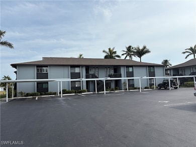 View of property with uncovered parking