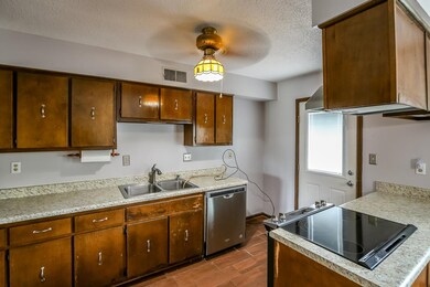 Kitchen featuring stovetop, sink, stainless steel 