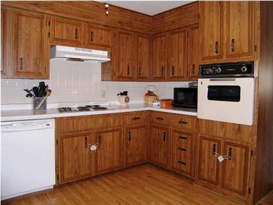THE SOUTH AND EAST WALL OF THE KITCHEN.