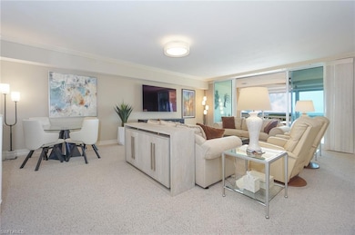 Living room with crown molding and light colored c