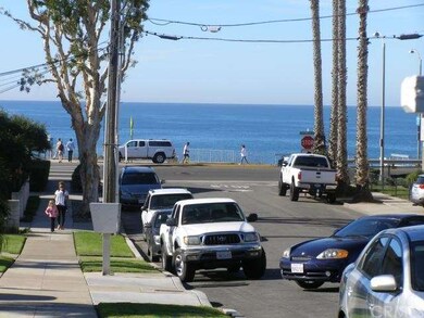 View of ocean/beach from driveway in front of hous