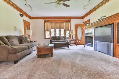 First floor family/living room with new carpet and fireplace