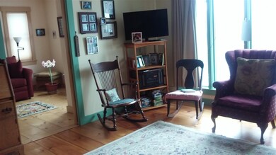 The living room looks into the Den/other room.