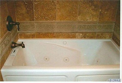 View of spa tub in guest bathroom.