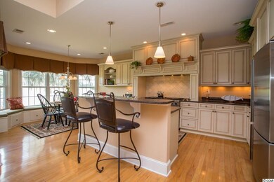 View from living room into kitchen and breakfast a