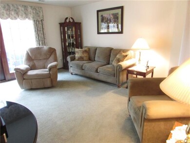 Spacious Living Room with triple Pella door to let