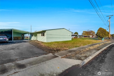 The home shares a driveway with the home next door.