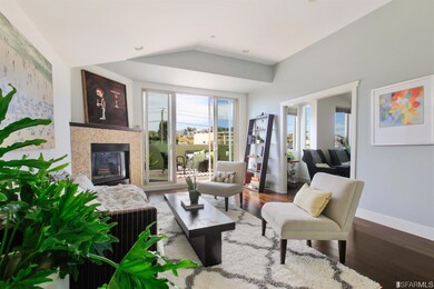 Open plan, sunny top floor living room. Doors open