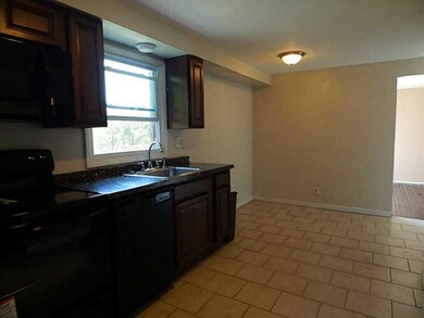 Kitchen. Updated kitchen, neutral tile flooring, e