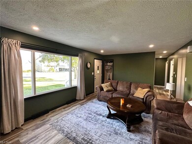 Living room featuring a textured ceiling and light