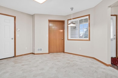 Plenty of room for a table in this breakfast nook.  Door leads to laundry room