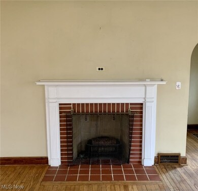 Room details with a fireplace and dark hardwood / wood-style floors