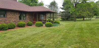 Back of home showing covered porch