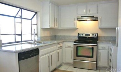 The kitchen window overlooks the hillside views.