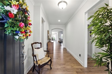 Hallway with arched walkways, ornamental molding, 