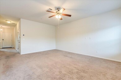 Unfurnished room with light colored carpet, ceili