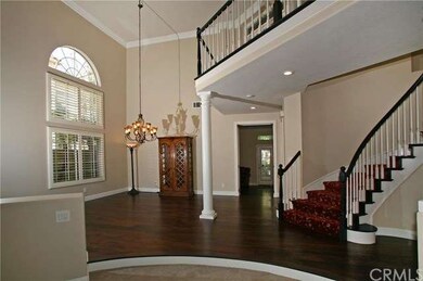 Grand Curved Staircase, High Ceilings and Windows