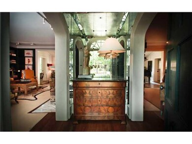 Standing in the Front door, this small but stately mirrored entry separates the formal living room to the left from the more informal Librairy/Den to the right.  Home of an Interior Designer, It does not look exactly like this now!