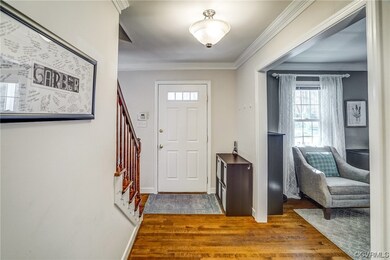 You'll find beautiful trim including crown molding in the open Foyer and also throughout the entire house.