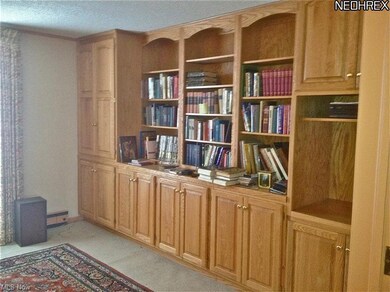 Built in bookcases and bar add great storage to th