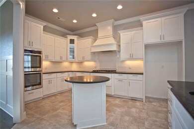 Double ovens and electric outlet in the island is