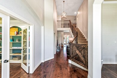 Gorgeous entry with vaulted ceilings and easy access to office and dining room.