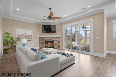Living room with light hardwood / wood-style floor