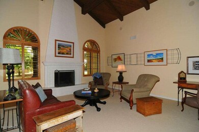 Living room with vaulted ceilings and fi