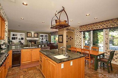 Chef's kitchen features island equally perfect for