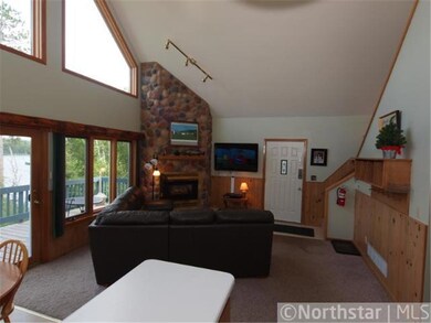 Floor to ceiling, stone fireplace, soaring vaulted