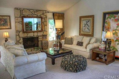 Large living room with majestic fireplace and high cathedral ceilings.
