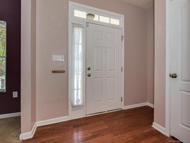 Pretty hardwoods, wide hallways and generous coat 
