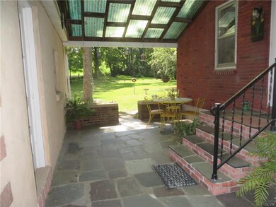 Breezeway connects 1 car garage