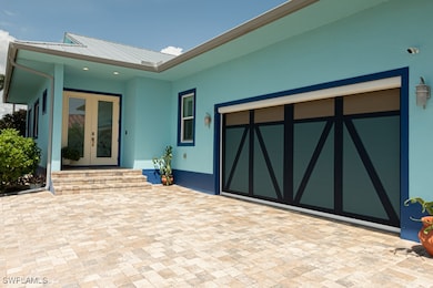 View of patio / terrace with an attached garage, d