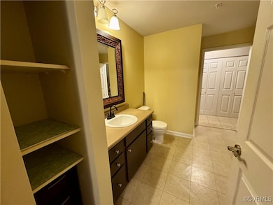 Bathroom with tile patterned floors and vanity