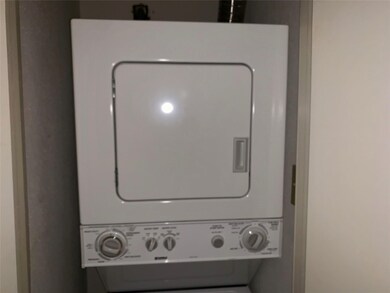 This photo shows a compact, stacked washer and dry